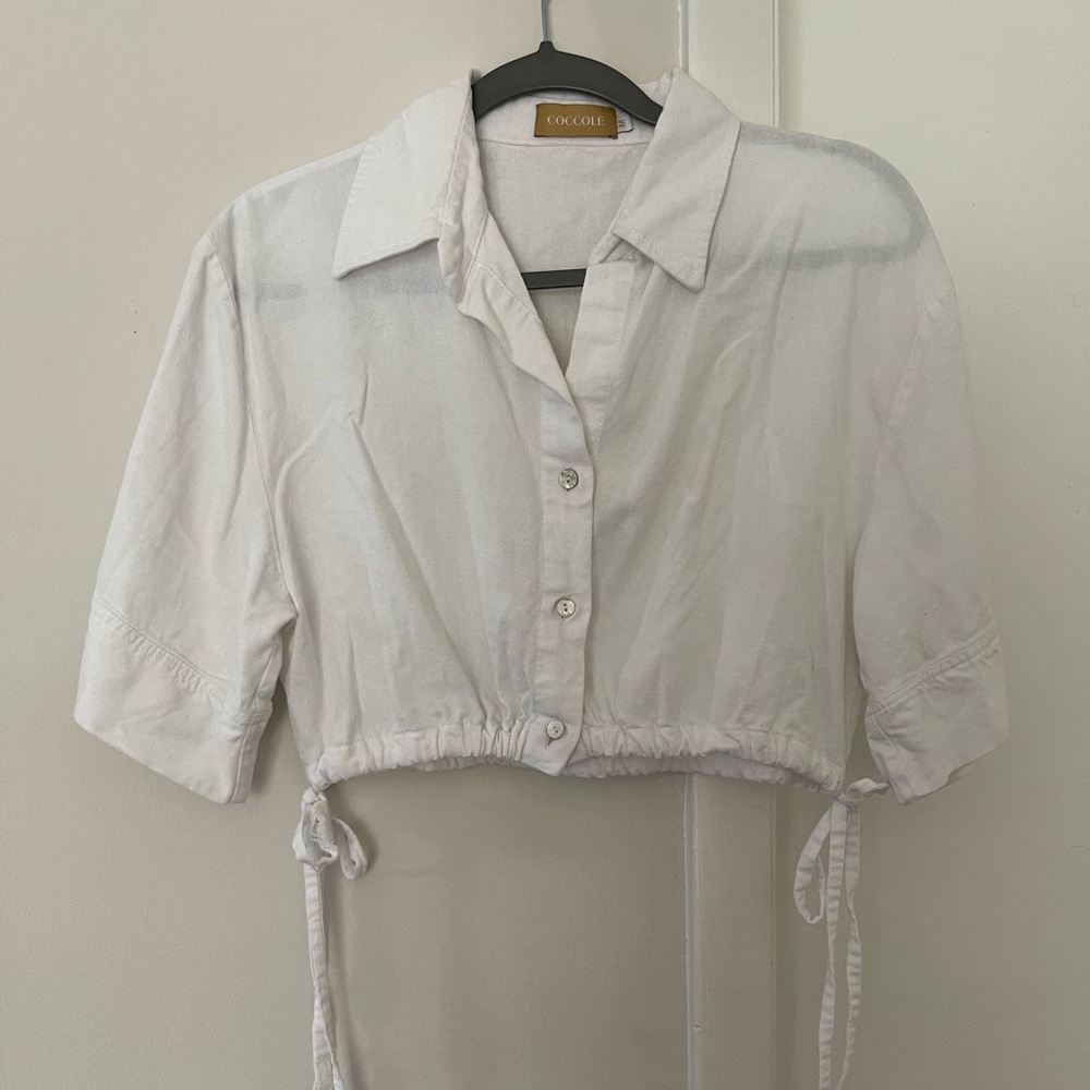 White cropped linen blouse.